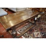 An oak plank top refectory table in the 17th century style, on bulbous supports.169cm x 78cm.