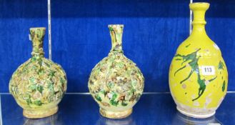 A pair of Canakkale vases, cream and green glaze with relief decoration, 25cm high and another