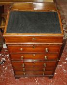 A 19th century Anglo-Indian rosewood Davenport, the sliding and formerly swivel top with a hinged