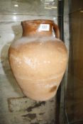 An early terracotta jug, 31cm high approx. Best Bid