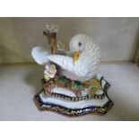 A Sevres porcelain dove, on branch, with mark to base, 13cm high approx.