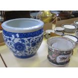 A modern blue and white fish bowl and a late Cantonese jardinière and stand