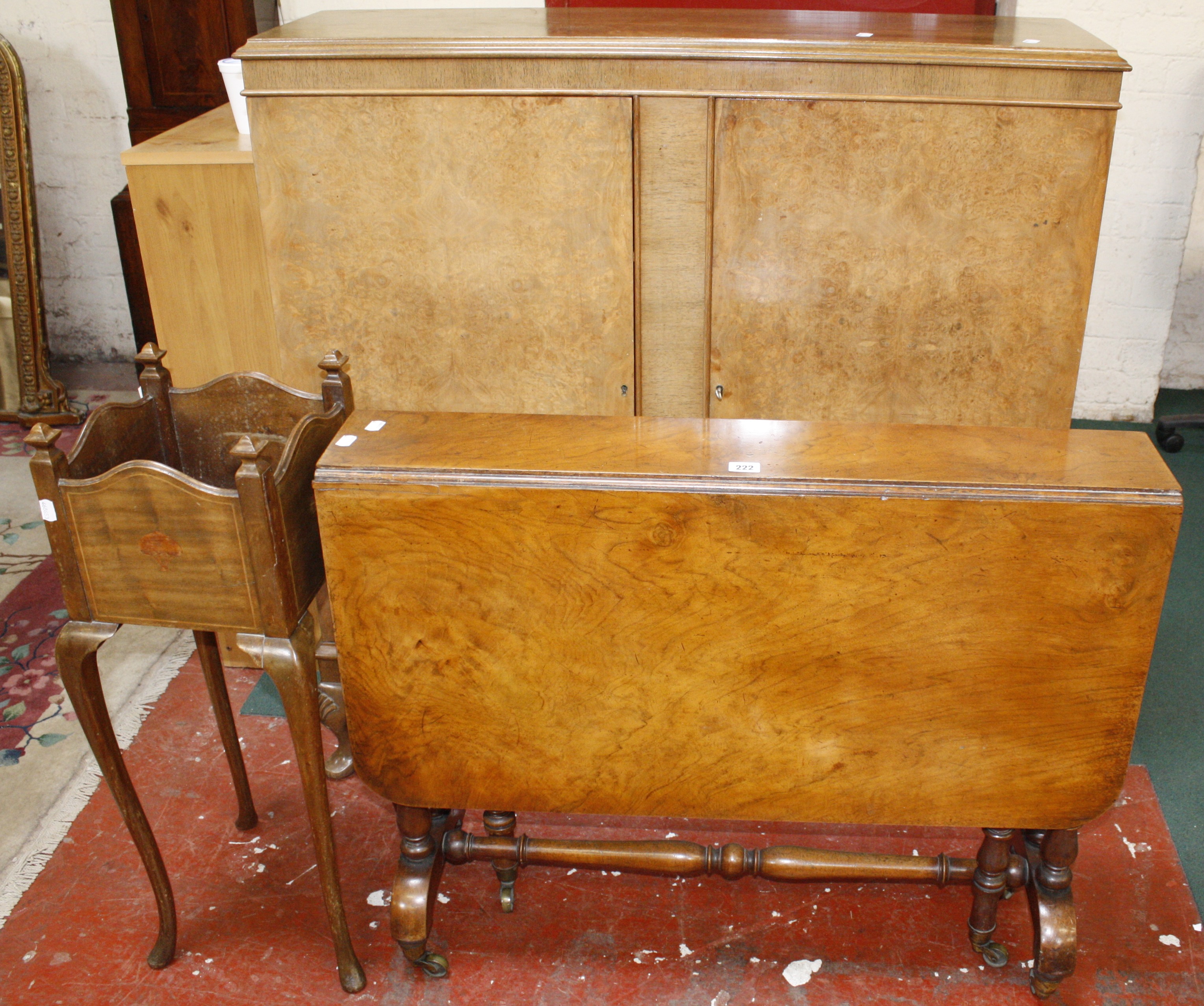 A Victorian walnut Sutherland table, a walnut cabinet and a planter.