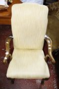 A Georgian style elbow chair raised on shell carved cabriole supports.