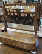 A 19th century mahogany dressing mirror with three drawers.