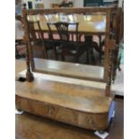 A 19th century mahogany dressing mirror with three drawers.