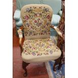 An Edwardian yew wood arm chair with tapestry back, seat and arm pads. Best Bid