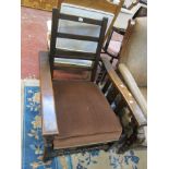 * A 1930's oak reclining chair.