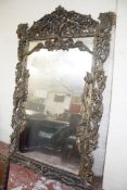 A large gold foliate framed overmantel mirror. 235cm x 141 cm.