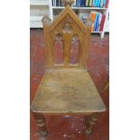 A Victorian pitch pine side table, gothic oak hall chair, spindle back chair, Edwardian tub chair