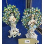 A pair of Derby of musicians, in front a floral bocage, 25cm high