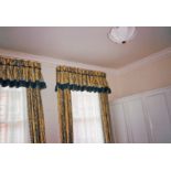 Two pairs of curtains, yellow ground with blue floral and lined decoration, lined and interlined,