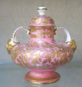 A Derby pink and gilt two-handled pot with cover, lion mask handles, 12cm high