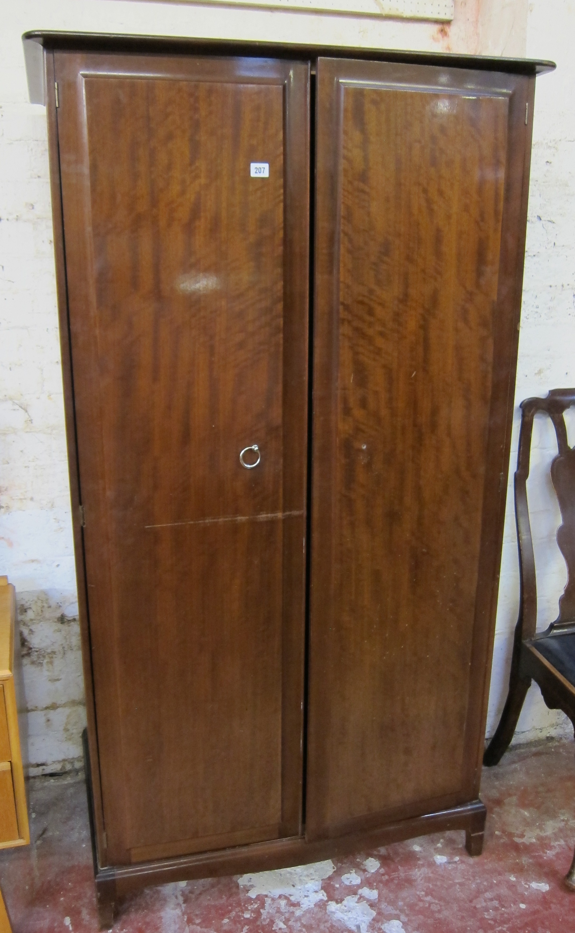A two door Stag wardrobe, a chest of drawers, a dining chair, an oak cabinet and stand Best Bid