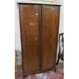 A two door Stag wardrobe, a chest of drawers, a dining chair, an oak cabinet and stand Best Bid