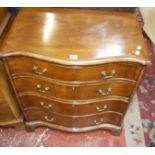 A Georgian style mahogany serpentine chest with four graduated drawers, 69cm wide.