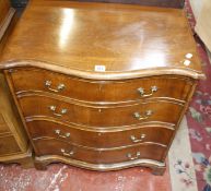 A Georgian style mahogany serpentine chest with four graduated drawers, 69cm wide.
