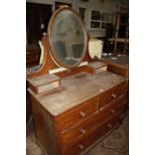 A Victorian mahogany dressing chest with central mirror. 105cm wide. and A Victorian brass fender