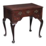 A George III mahogany lowboy, circa 1780, with crossbanded top above one long and two short