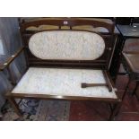 An Edwardian two seater settee. A/F 92cm wide.