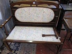An Edwardian two seater settee. A/F 92cm wide.