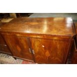 A 19th Century Dutch mahogany cabinet, with inlaid shell decoration, with hinged lid and cupboard