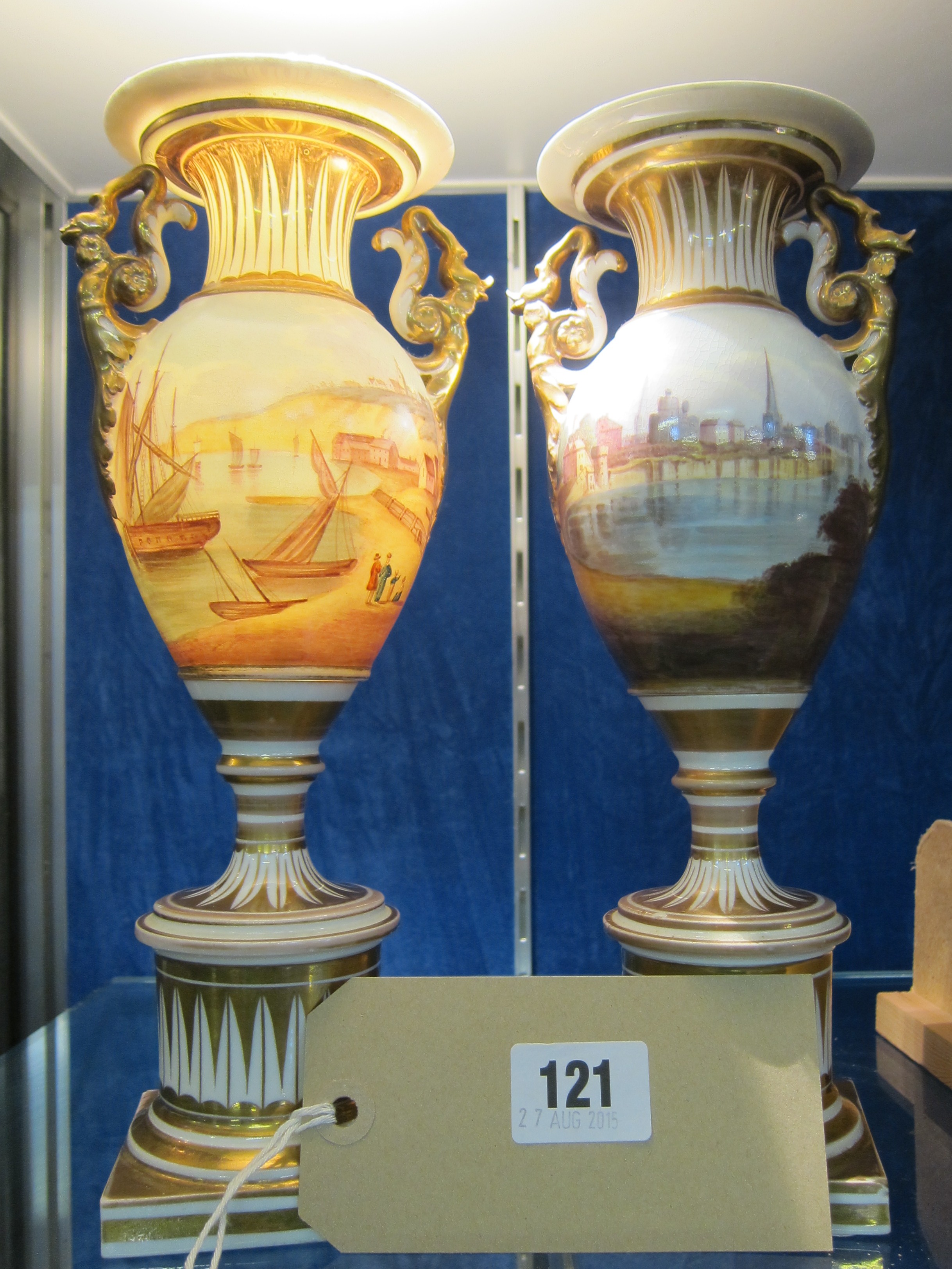 A pair of two-handles pedestal vases, decorated with fishing boats and coastal village, marked to