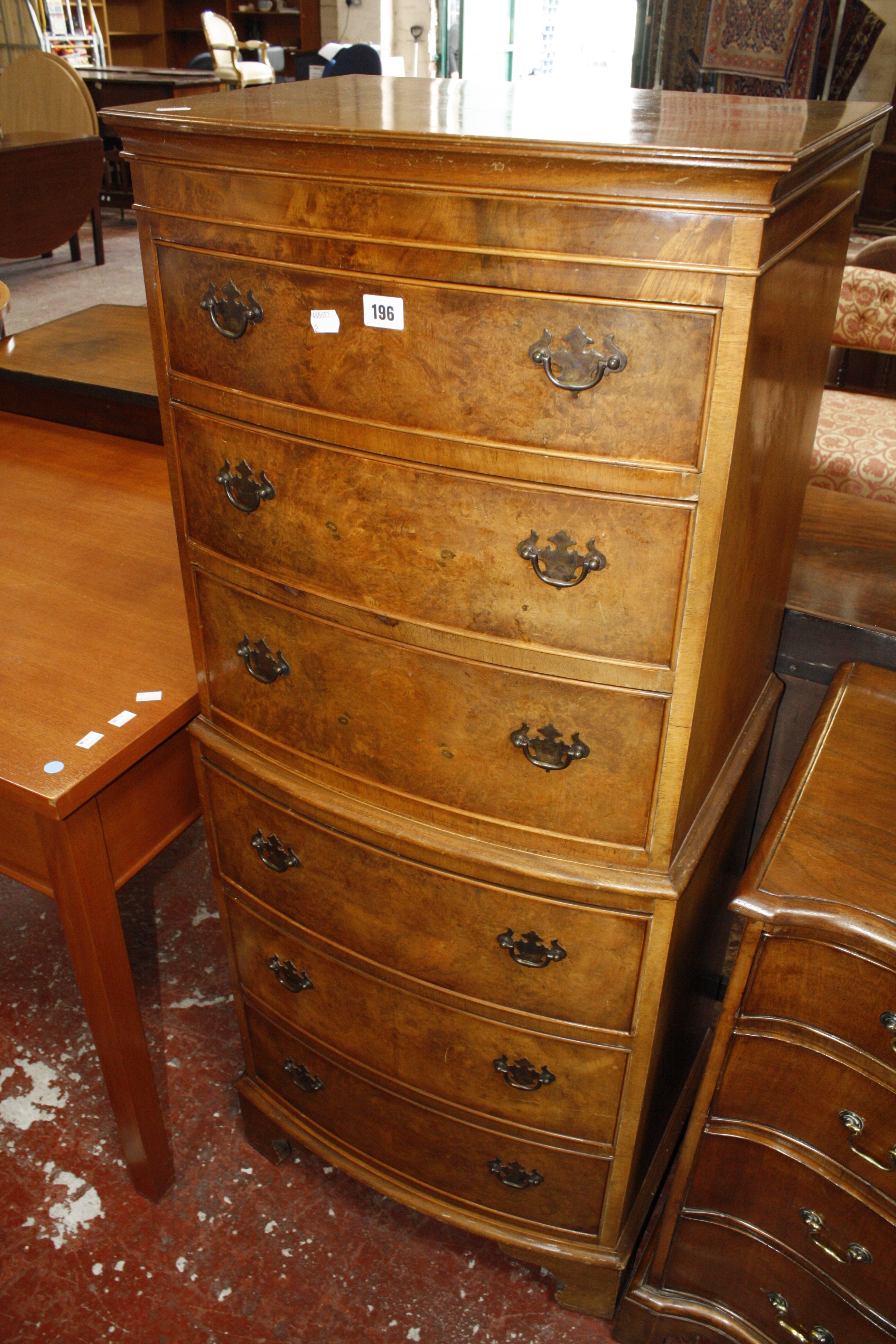 A Georgian style miniature walnut tallboy with six drwaers, 54cm x 132cm.