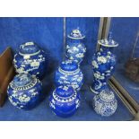 Five blue and white ginger jars with covers, assorted sizes and two similar blue and white