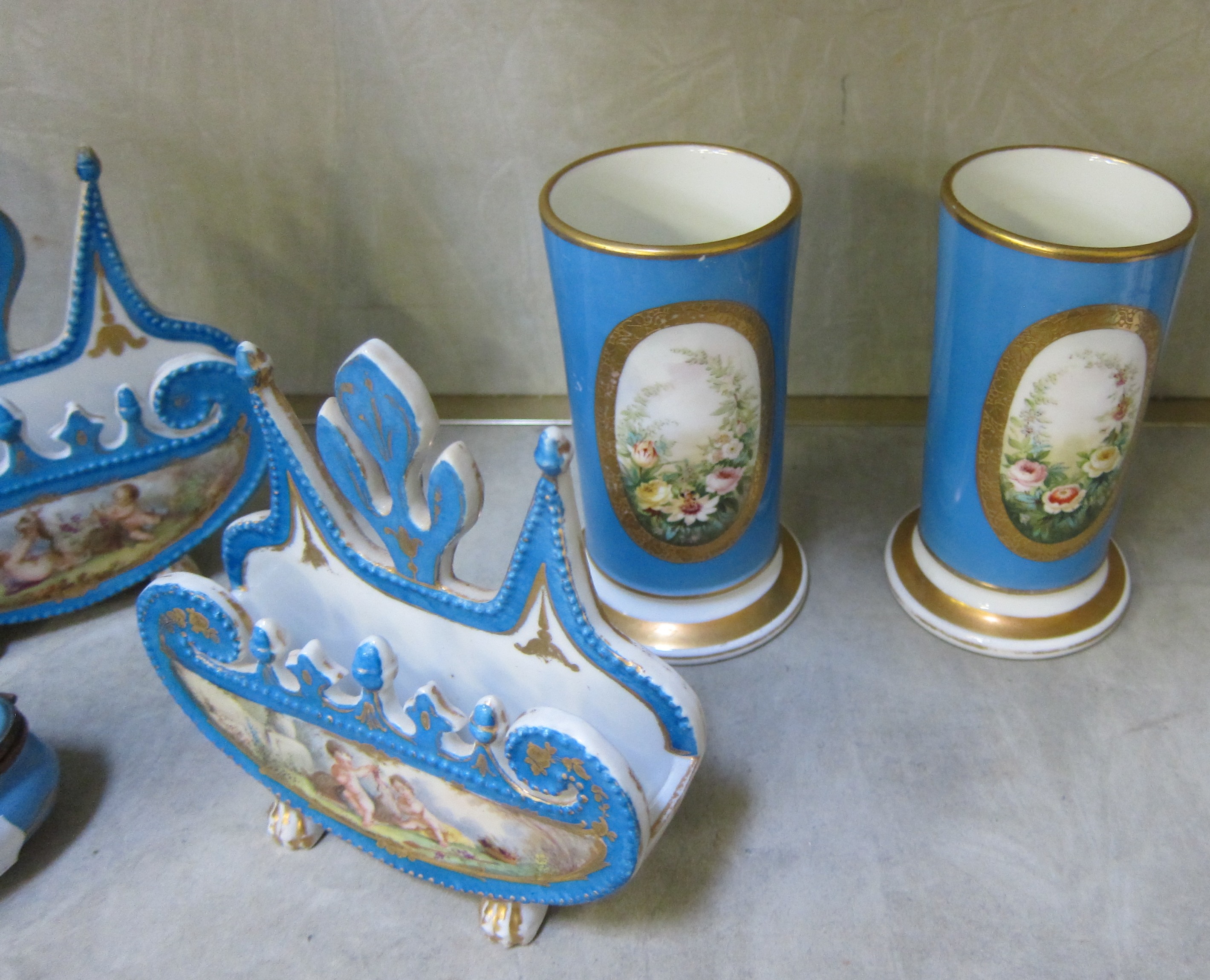 A pair of Sevres style vases painted and gilt with reserves of cherubs, on Bleu Celeste grounds, - Image 2 of 3