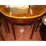 A demi-lune side table, mahogany with satinwood fan inlay. 98cm wide, and an oval framed mirror.