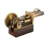 A Stirling model Hot Air Engine, built by Mr Peter Hissey of Middlesex in brass with two cylinders,