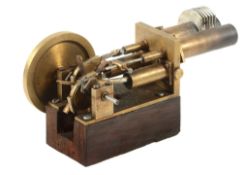 A Stirling model Hot Air Engine, built by Mr Peter Hissey of Middlesex in brass with two cylinders,