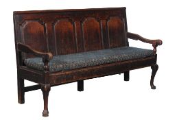 A George II oak panel back settle , circa 1740 and later  A George II oak panel back settle  , circa