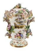 An English porcelain flower-encrusted pot-pourri urn and cover , circa 1835  An English porcelain