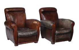 A pair of leather upholstered armchairs , circa 1930, one with green arms  A pair of leather