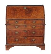 A George II walnut feather-banded bureau, circa 1750  A George II walnut feather-banded bureau,