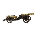 Two late Victorian brass and iron mounted models of canon, late 19th century  Two late Victorian