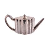 A George III silver shaped oval teapot by Peter Carter,   London 1788, with a finial to the flat