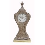 A silver coloured clock,   stamped 800, Swiss alarm movement, white dial, luminous fancy hands,