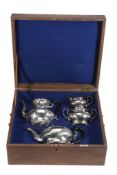 An Edwardian silver four piece baluster tea service by Stewart Dawson  &  Co.,   Birmingham 1906,