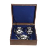 An Edwardian silver four piece baluster tea service by Stewart Dawson  &  Co.,   Birmingham 1906,