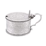 A Victorian silver oval mustard by John, Edward, Walter  &  John Barnard,   London 1872, with a