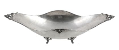 An Italian hammered silver coloured elongated quatrefoil bowl,   1944-68 .800 standard, with twin