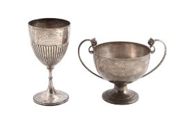 A silver twin handled trophy cup by H. Phillips,   London 1953, with twin mask and loop handles,