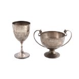 A silver twin handled trophy cup by H. Phillips,   London 1953, with twin mask and loop handles,