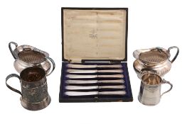 A small collection of silver,   to include: a small silver oblong baluster tea pot by Harrods Ltd.,