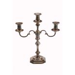 A silver three light candelabra by Mappin and Webb,   with circular sconces, baluster capitals, a