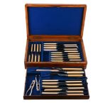 An oak cased set of stainless steel knives by Mappin Brothers,   with ivorine handles, comprising: