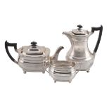 A matched silver oblong baluster part tea service,   comprising: a tea pot and sugar basin by